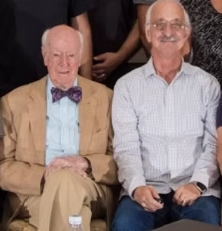 Dr. William Murphy and Dr. Woodie Flowers sitting together