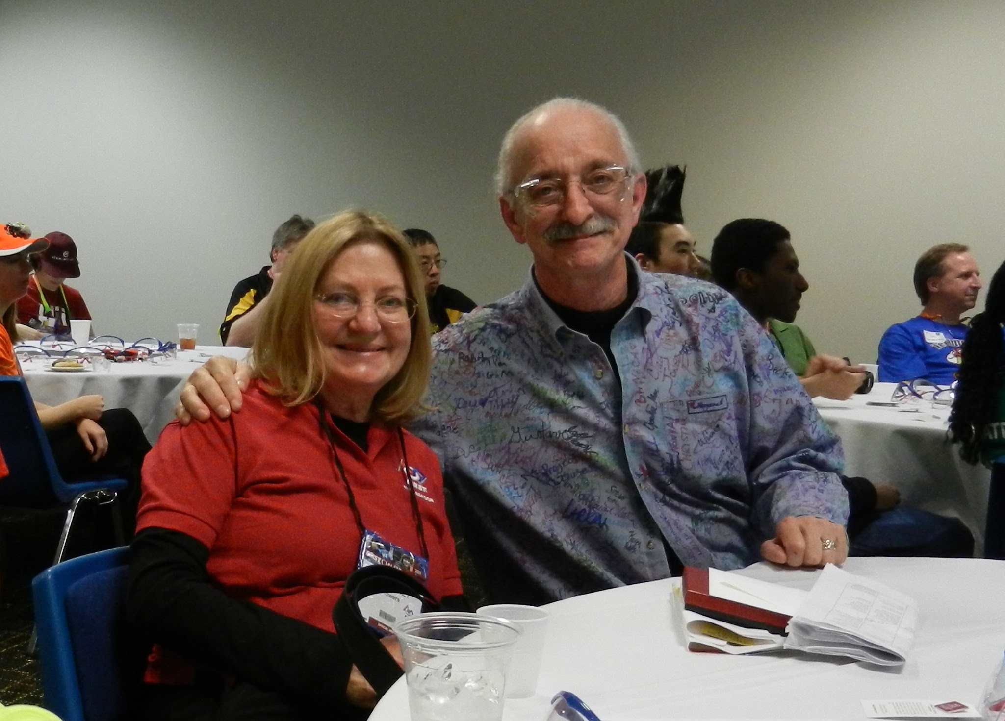 Dr. Woodie Flowers and Margaret Flowers sitting together at a table at the 2011 FIRST Championship in St. Louis